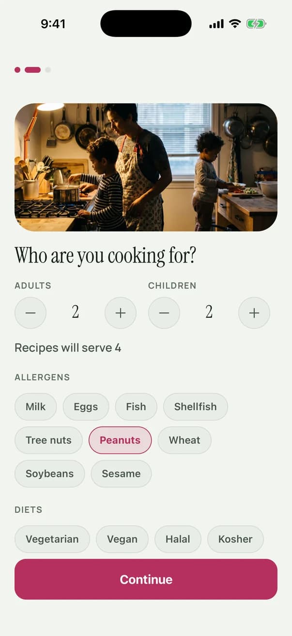 The household screen: a photograph of a parent cooking with two children, headed Who are you cooking for, steppers set to two adults and two children, a line reading Recipes will serve 4, the nine major allergens with peanuts selected, and the diet options.